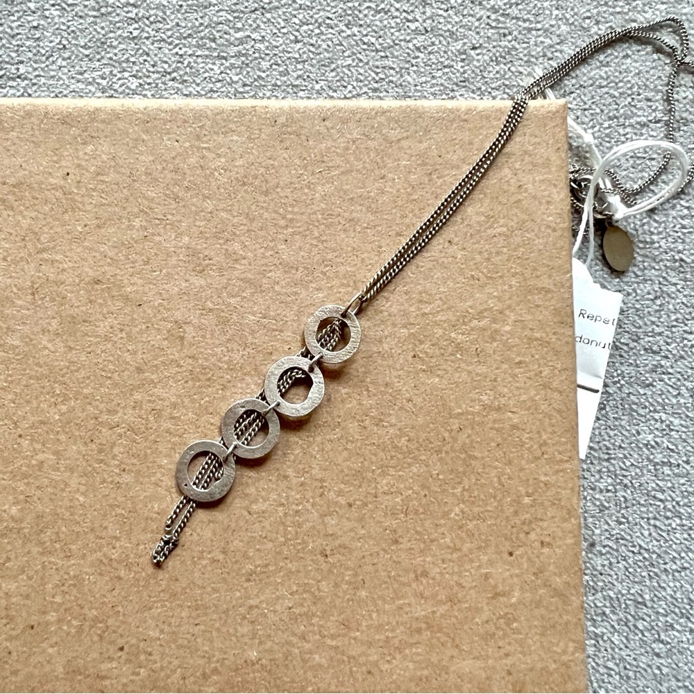 Matt sterling silver discs and tassels necklace